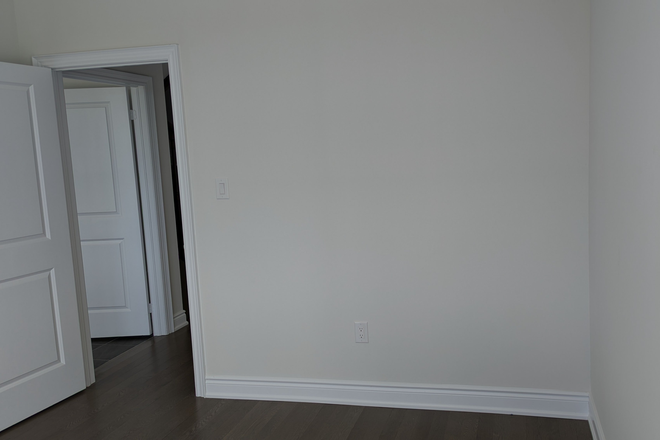 Room with south exposure.  Hardwood flooring with high ceilings and tall windows. Approximately 120 square foot room. Shared bathroom with 1 - New Townhouse Close to Amenities + Transportation