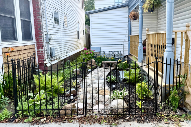 Side porch and Garden - Great 3 Bedroom Apartment with In Unit Laundry and Off Street Parking