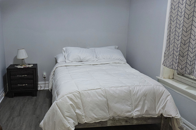 Fully furnished bedroom with clean, modern setup - All-Inclusive Furnished 2BR | No Utility Bills | Garage Parking | Convenient to UIC (25–30 Min)