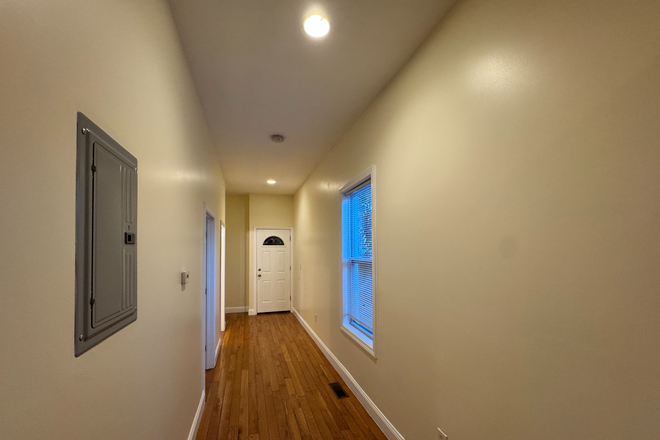 Hallway that leads to bedrooms - Spacious 3BR With Parking + Backyard Minutes From Northeastern House