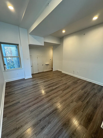 Living room (Now furnished with TV, couch, chairs, tables) - Looking for Roommate - 3 Bed 2 Bath with Balcony, 10 Min From Campus, Next to Trolley, $1070 Apartments