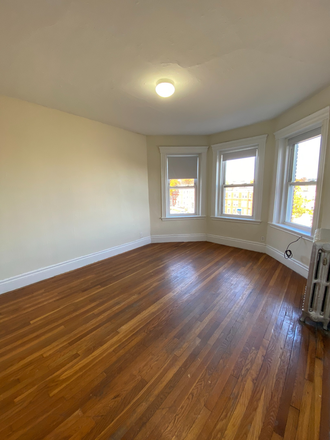 Visit hubrealtyproperties.com - Stately large one bedroom, with bay windows, Packards Corner
