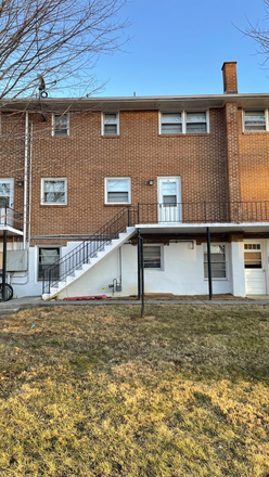 Entrance from the parking lot. Stairs to the balcony. - 2BR pet-friendly for spring 2026!