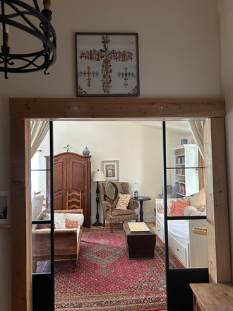 view into the living room/library from the foyer entrance - Half of Lovely Retreat-like French Country House/garden 10 min to U of A, very quiet and peaceful