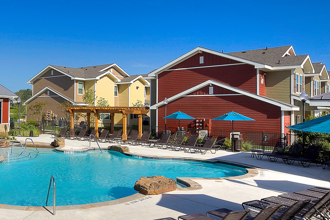 Outside View with Pool - U Club Townhomes on Marion Pugh