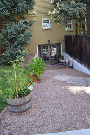 Private entrance, outside street view - Walk to Campus. Large garden level, 1-bedroom, furnished apartment with open plan kitchen living.