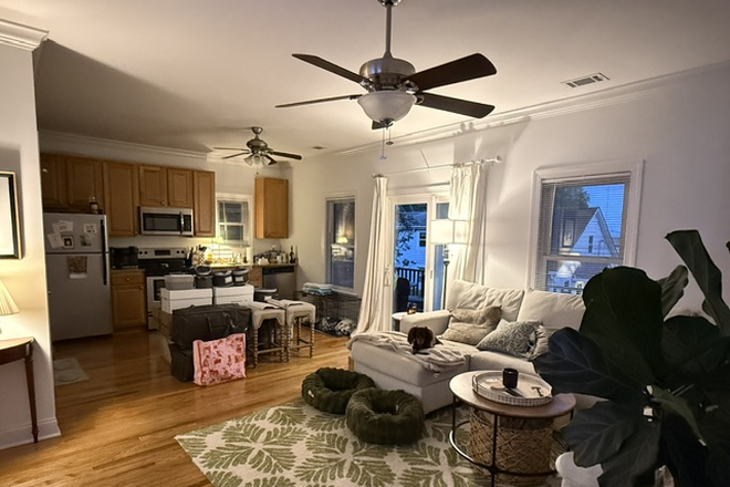 Living room and kitchen - Two-bedroom garage apartment overlooking Clark Sound on James Island. Rent includes all utilities.