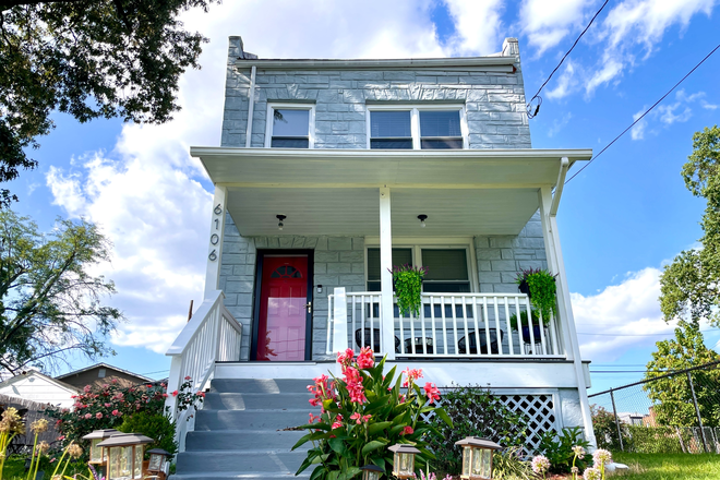 Front of the house with porch - Beautifully Furnished Off Campus Housing owned by Howard University Graduates House