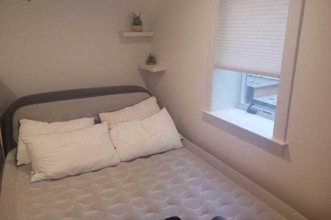 Bedroom and Bedroom Window - Complete Furnished Basement Apartment