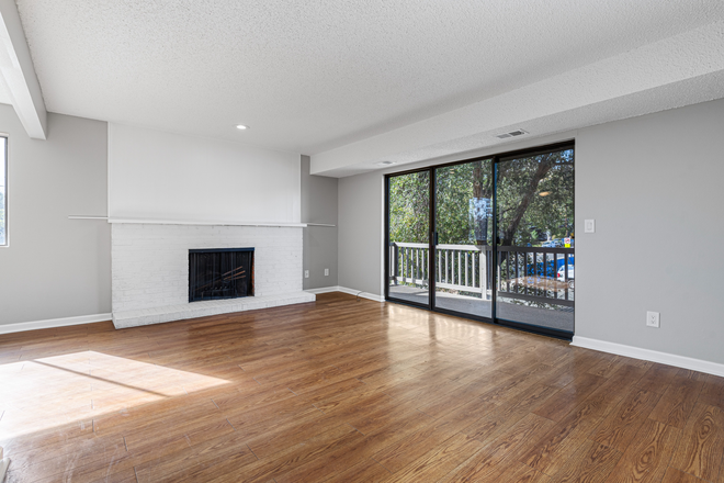 Living Room onto deck area - Baseline Tower UNIT#14. Updated 2 bdrm, 1.5 ba condo.  East Hill area, near campus.  1-4 occupants