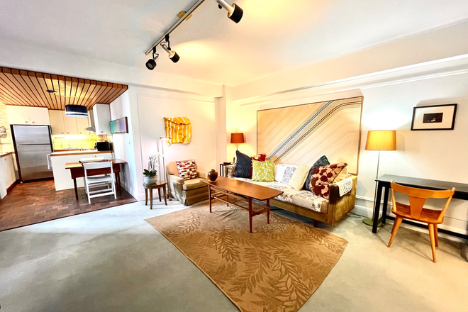 Living Room with kitchen to left - Fully Furnished 1 Bed Room. Ideal for Visiting Faculty or Fellow Condo
