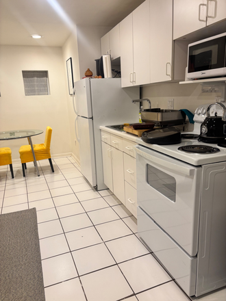 Main Kitchen and Dining - Modern Furnished Historic Shaw One Bedroom Townhome