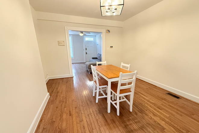 Dining/Living room view: 1st Floor - Bright & Modern Rooms Near UMMC – All Utilities Included. Townhome