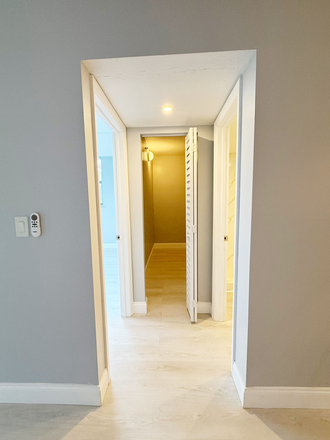 Hallway to large walk-in closet / guest bedroom / guest bathroom - Remodeled Corner 2BR/2BA Near NSU – Only $1,000 Deposit! Condo
