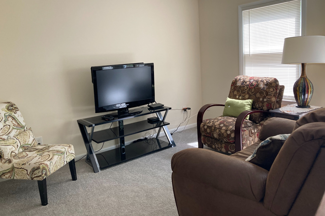 Living Room w/Smart TV and Firestick - THOUGHTFULLY FURNISHED, FULLY EQUIPPED, UTILITIES INCLUDED, PRICED TO RENT! JUST MINUTES FROM W&M! Townhome