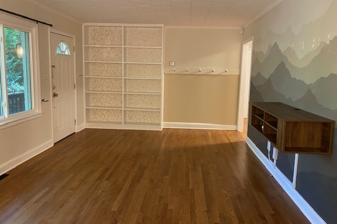living room with built in bookshelves - Charming 3-BR 2-BA in quiet, professional neighborhood walking distance to campus House
