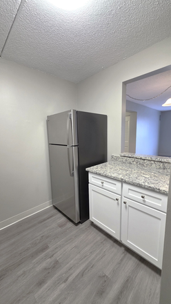 Upgraded Kitchen with peak through window!  Cooking for the roommates and hand it over. - *Share an Apartment! Private Rooms En-Suite Bathrooms starting at $1450 Per Person Next to UMass!*