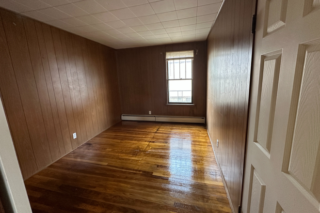 bedroom - 126 Pleasant St 1st flr 3 bedroom Apartments