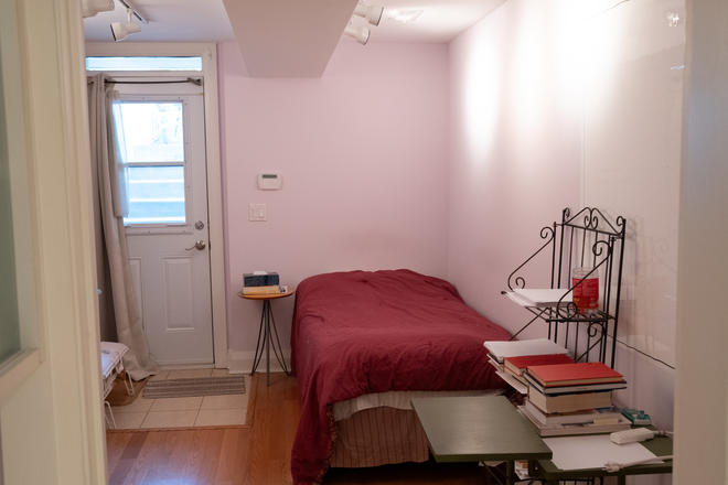 Bedroom looking west - Fully furnished all-inclusive one-bedroom basement suite with private laundry, close to downtown Apartments