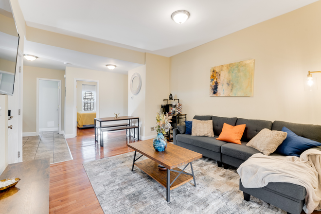 Living Room and Coffee Bar - Secure, Furnished Individual Bedrooms Available Near JHU Shuttle Stop & Penn Station Apartments