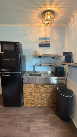 Fully functional kitchen area with Keurig and air fryer. - Brand-New Furnished Unit Near MUSC & Folly Beach