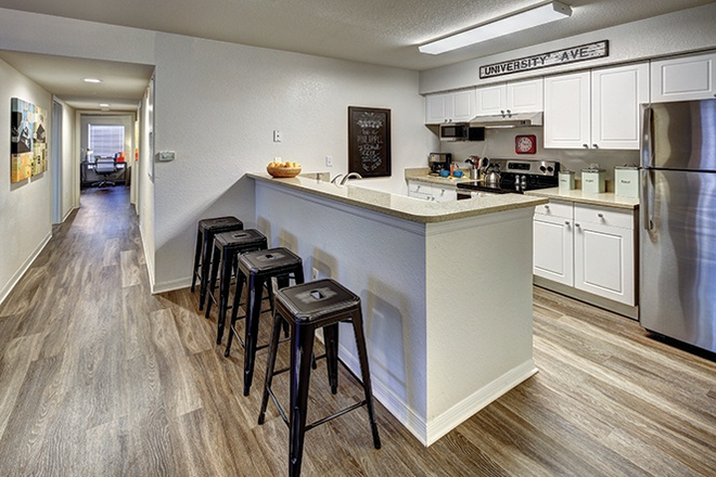 Kitchen/Island - The Village at Science Drive Apartments