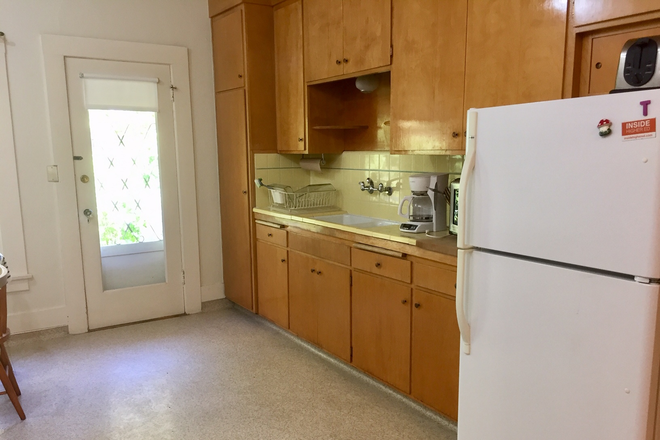 Kitchen facing back yard - Quiet, sunny, elegant 2 bedroom, furnished, on garden, in Elmwood area of Berkeley, WALK to campus Apartments