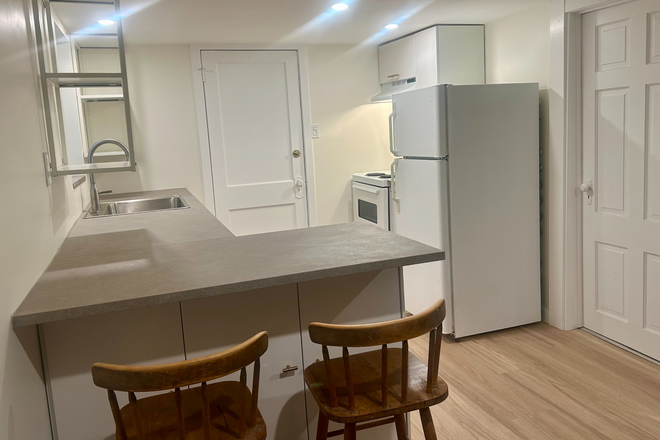 Kitchen with Eat In Island - Private Basement Riverdale Suite | Bright & Newly Renovated | Opt. Academic Year Lease at $1,775 Apartments