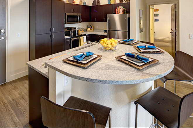 Furnished Kitchen island - Plaza on University Apartments