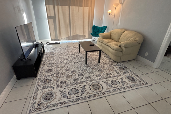 Living room with 55” tv - Furnished Ground Floor Room w/Private bathroom– Walk to FAU Condo