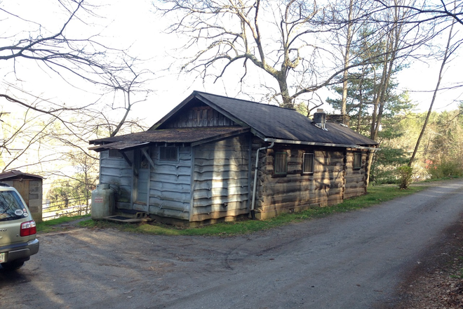 exterior from back. - Log Cabin. Excellent Location. 2 min. walk to WCU Campus.  View of River. Apartments