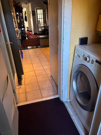 laundry machine by the back entrance - Quiet/Clean Furnished Room/House/Ossington Subway/Live in Owners/$1,050./all incl. Jan. 1.2026
