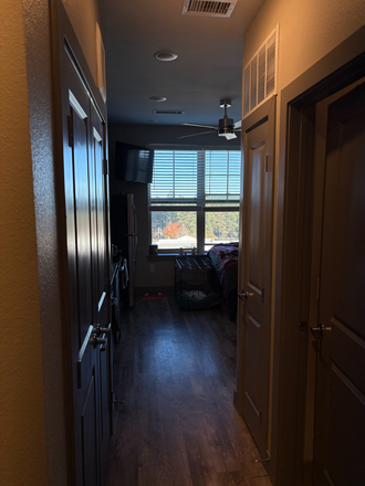 Walkway from Front door to kitchen/bed space - Elara at the Sawmill Apartments