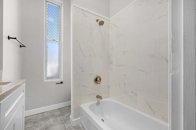 Bathroom - Charming 2BR w/ In-Unit W/D | Historic Building Near JHU Triplex