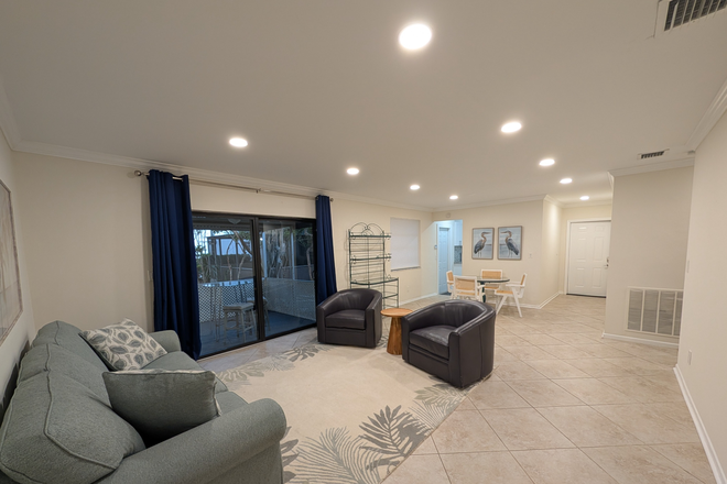 Living Room & Dining Area - Spacious, Furnished 3/2 Updated Duplex House - Steps from Campus