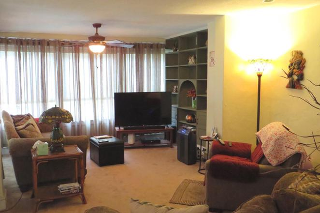 Living Room (no longer carpeted, dated picture) - Townhouse Close to Campus on Rexford St