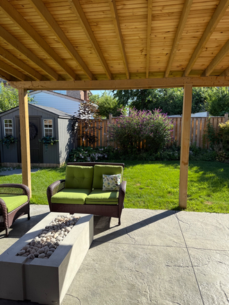 Back yard - Furnished bedroom with private bath in a clean, semi-detached home with access to laund