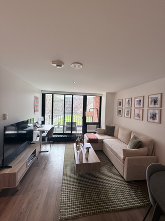 Living room - Fully furnished 1-bedroom apartment next to HBS (Soldiers Field Park). Utilities included!