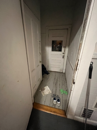 Hallway into the porch from kitchen - boardwalk properties Triplex