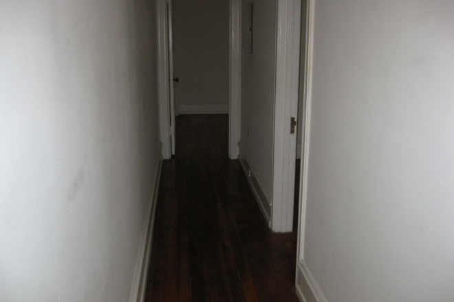 Hallway which includes a walk-in closet - Classic vintage apartments in University City.  Rent includes most utilities.