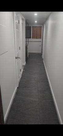 On the left, BA door and kitchenette. BR/Living area behind door on the right - Newly-renovated Basement studio with full-sized windows in SFH; 1 mile to CUA House