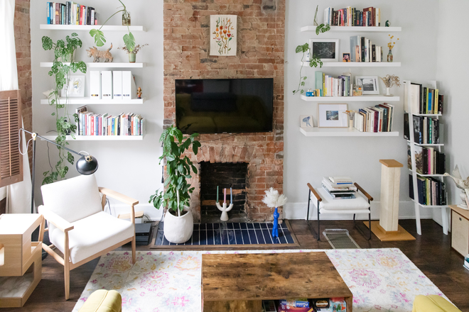 Bedroom/Living room facing front of street. Exposed brick & beautiful windows letting in tons of natural light. Smart thermostat & TV mount - 124 Winkler Street Apartments Unit #1