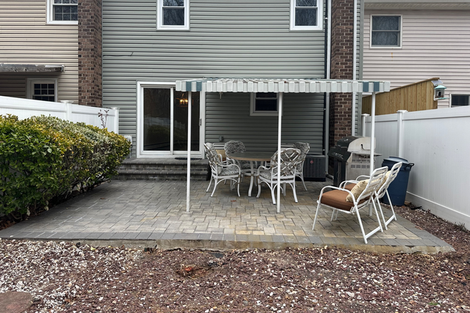 Back yard/patio - 3 bedroom condo with furnished outdoor patio & private yard