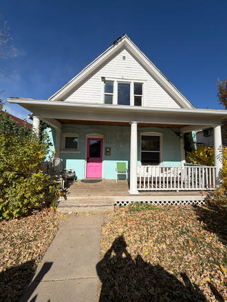 Front of House, has a furnished patio and you can walk around to the back of the house on either side - Housing on the Hill