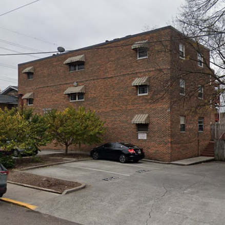 Outside view with parking space steps from front door - Condo walking distance to campus