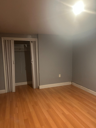 front/living room - Easy and convenient 2 bdrm, 1 bath w/ outdoor patio near MBTA available 7/1 $2,500.00 per month Apartments