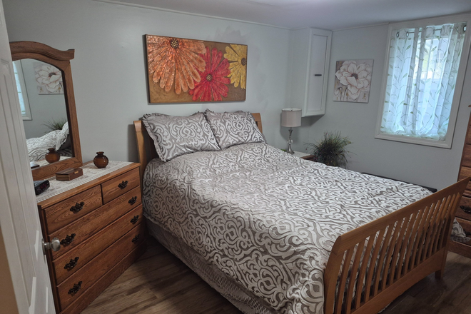 Queen sized bed with 2 bureaus and a large walk-in closet. - Comfortable, fully furnished 1-bedroom apartment with office