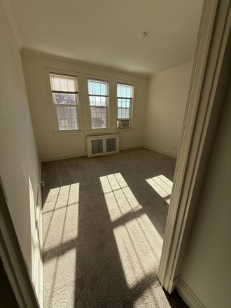 Bedroom through perspective of door frame - Connecticut Heights Apartments