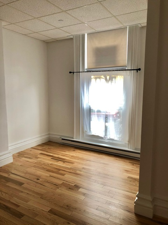 Visit hubrealtyproperties.com - Front facing studio with new hardwood floors and freshly painted, near MIT Apartments