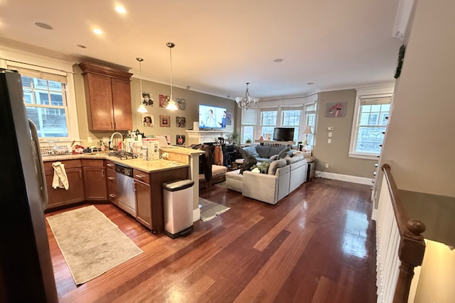Kitchen and living room - Mission Hill 3BD|2.5BA Townhouse | 1 mile to Northeastern | Roof Deck + Garage